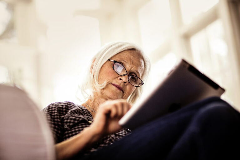 senior woman using tablet