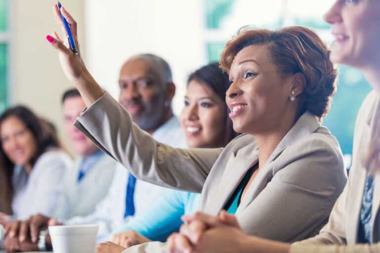 woman raising hand