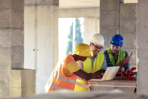 Construction workers going over safety training for better workplace communication