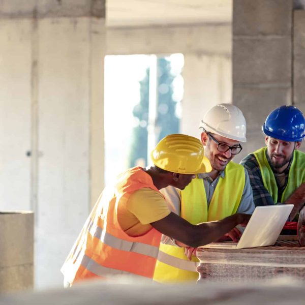 Construction workers going over safety training for better workplace communication